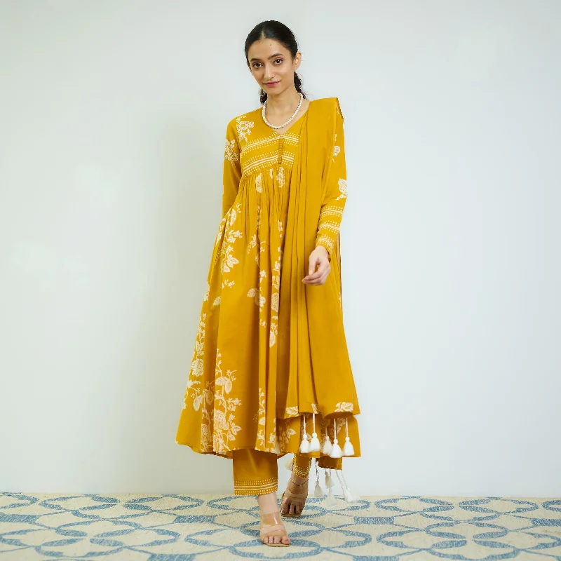 Trend Setting Wardrobe Zehra Yellow Cotton Kurta Set with Mul Cotton Dupatta & Tassel Detail